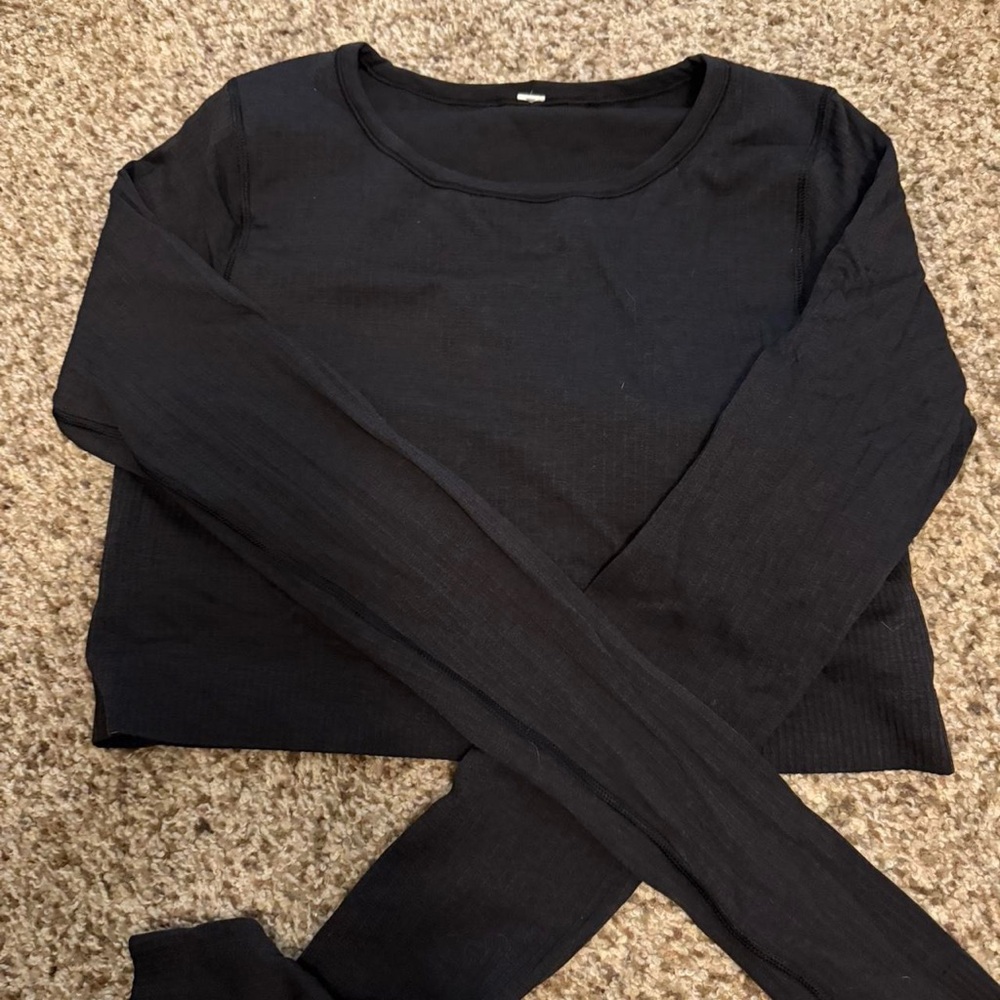 Lululemon Black Long Sleeve Workout Top. Has a built in bra/padding.